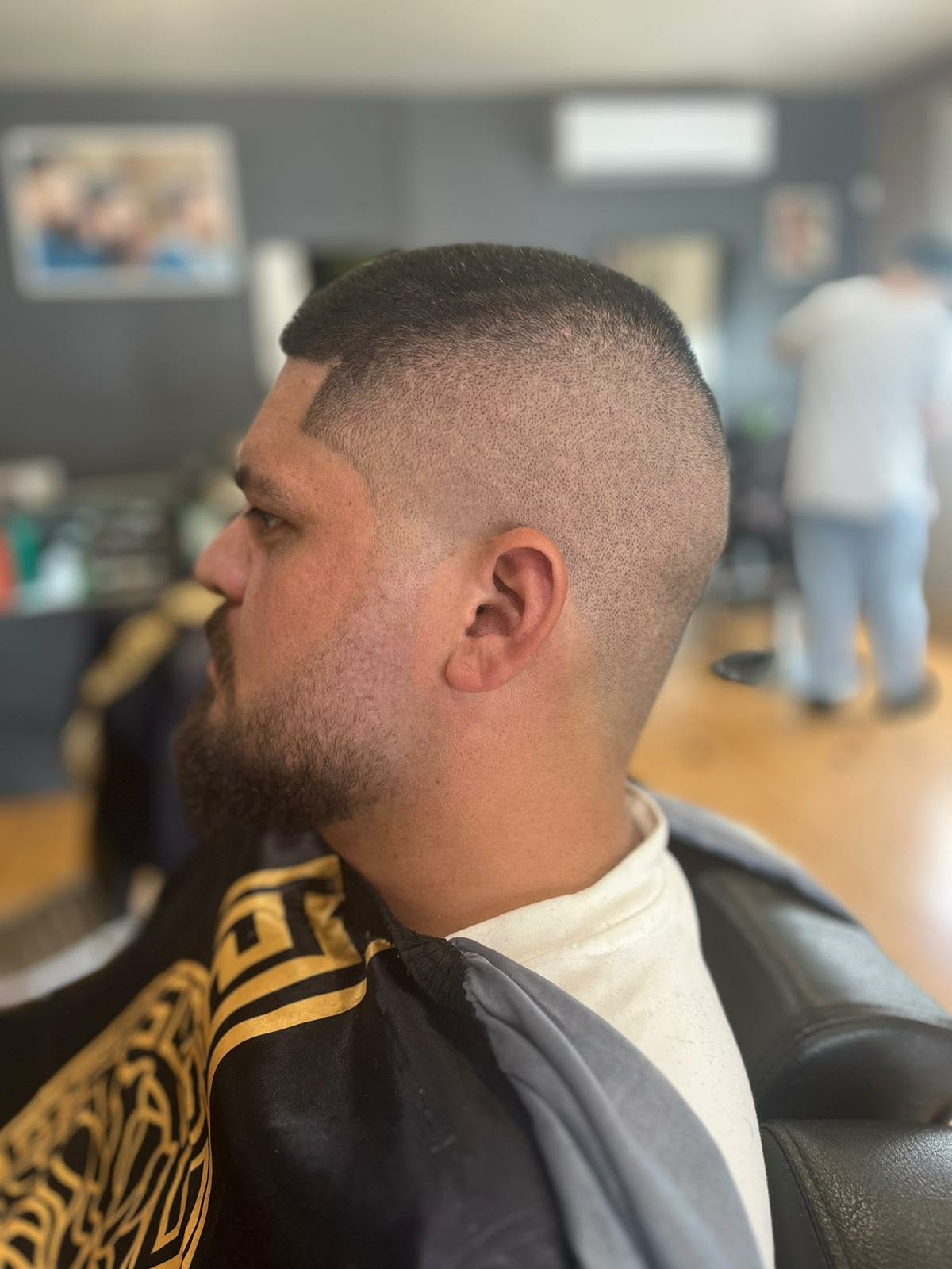 Buzz cut with a sharp line-up and skin fade at Castle Barbers